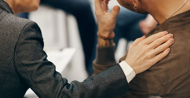 Person speaking with a counselor.