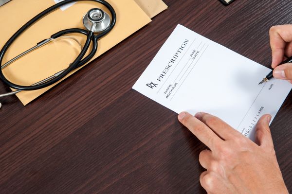 Doctor writing a prescription.